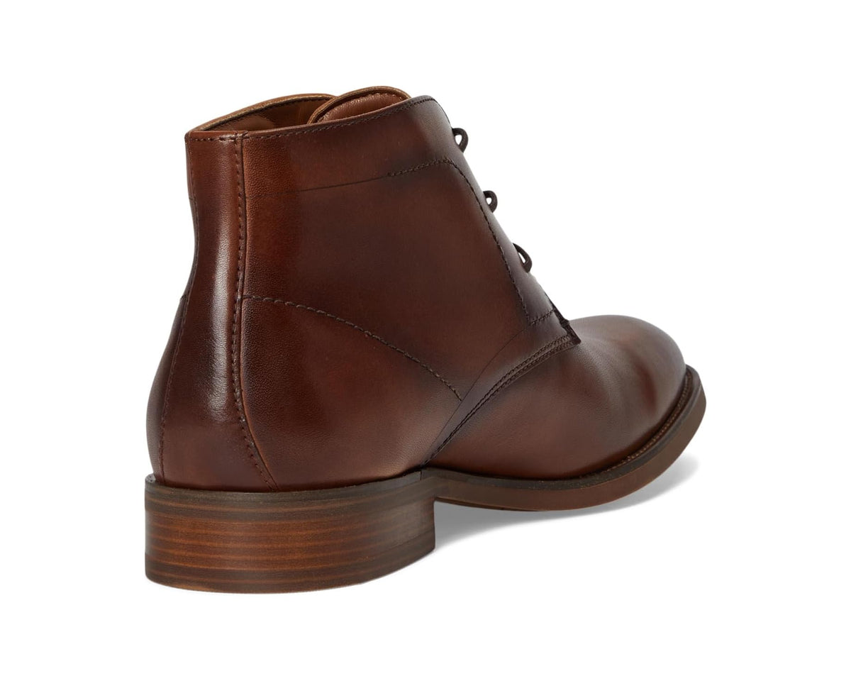 Tan leather chukka boot back view with stacked heel and lace eyelets