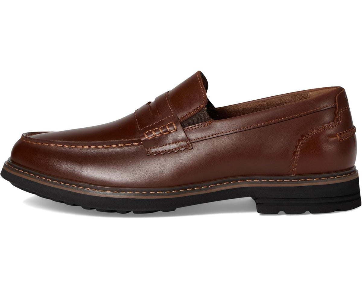 Cognac moc-toe penny loafer with penny strap, stitched upper, black tread sole
