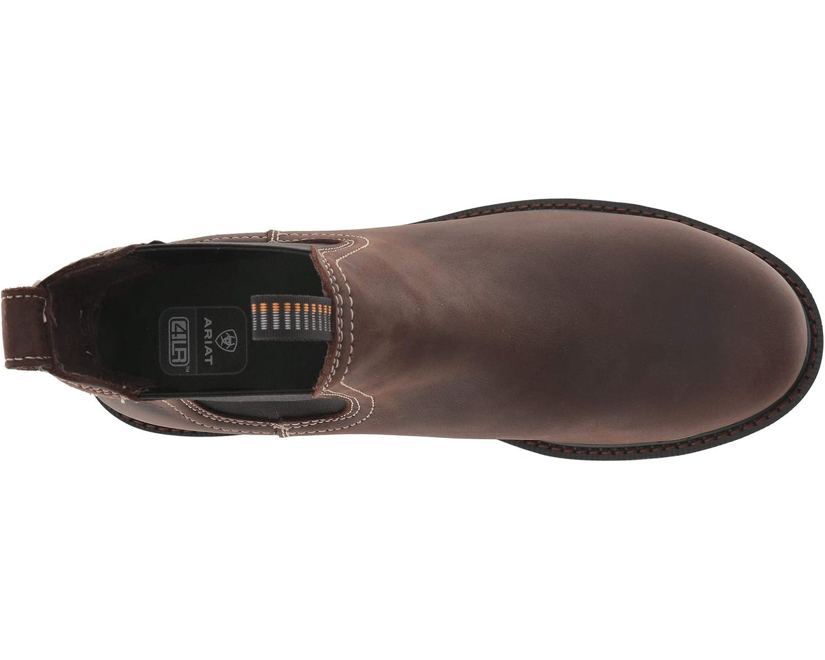Dark brown Chelsea boot side view with stitched welt and Ariat logo badge