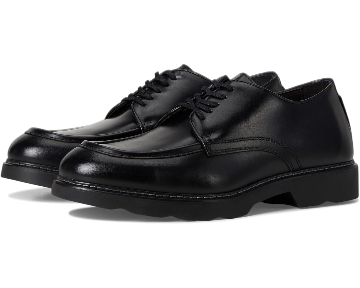 Black moc-toe derby shoe with lace-up closure and cushioned sole.