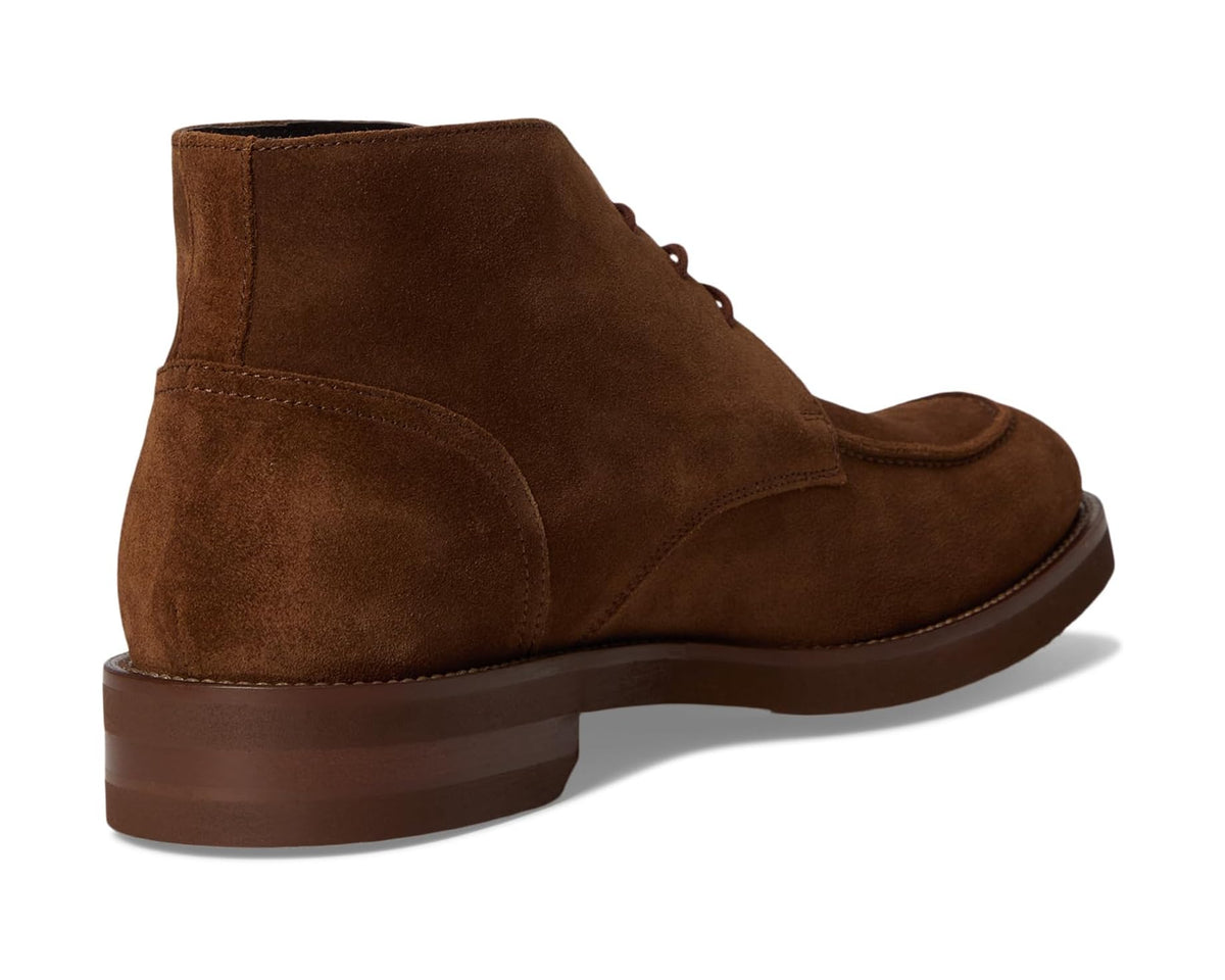 Dark brown suede chukka boot back view with ankle collar and low sole