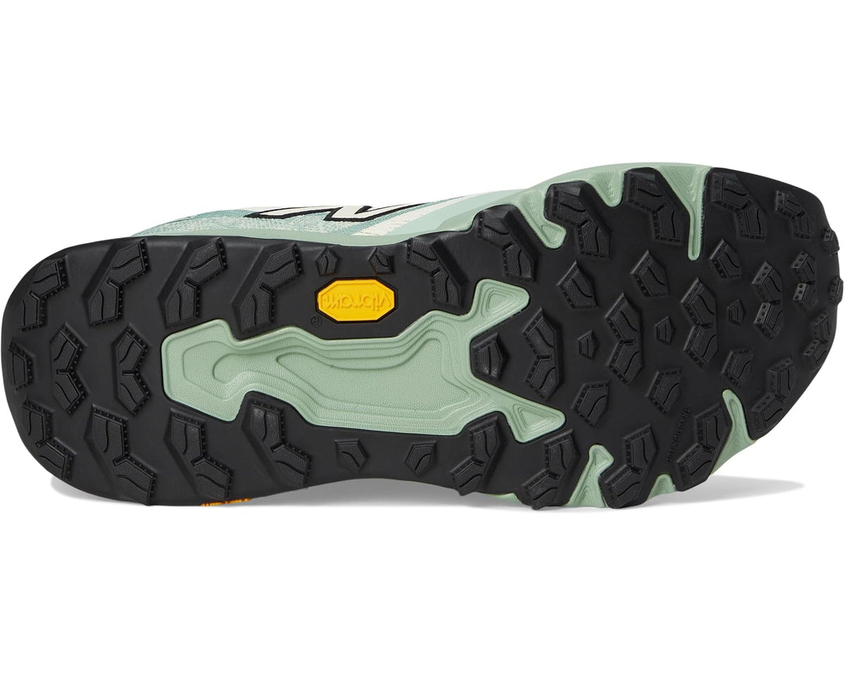 Men's New Balance trail shoes outsole with dark traction tread and green accents