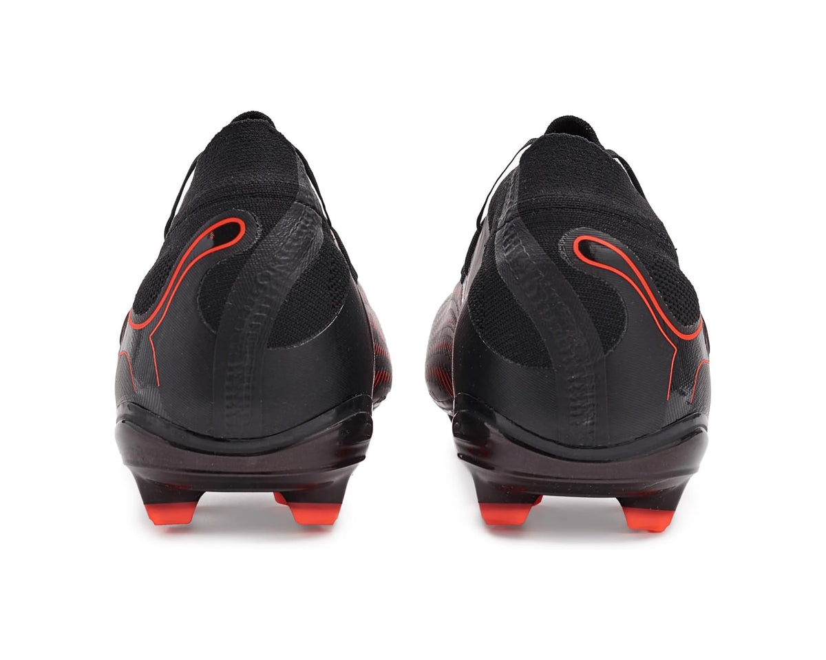 Black soccer cleats with Glowing Red heel accents and firm-ground orange studs.