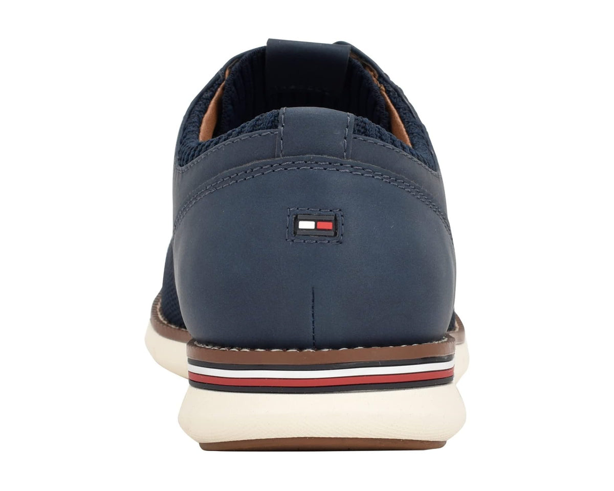 Men's navy lace-up shoe with heel pull tab and striped sole trim