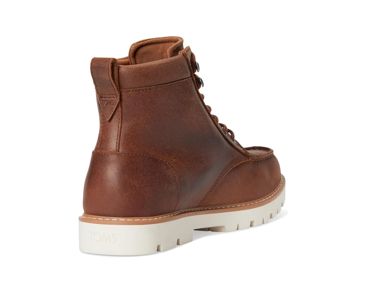 Tan leather ankle boot with padded collar, lace-up, and white tread sole