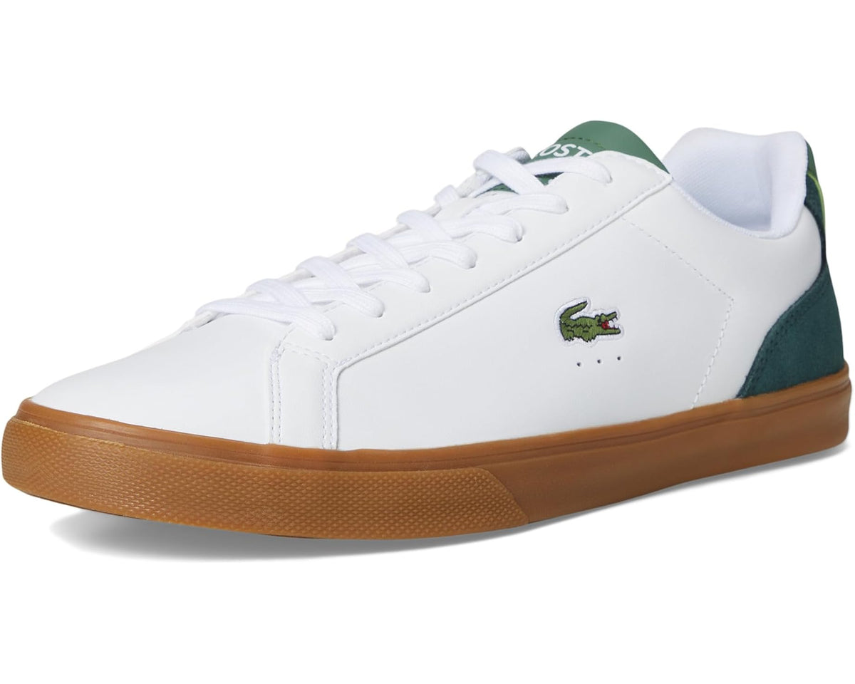 White low-top sneakers with green side panel, crocodile logo, and gum outsole