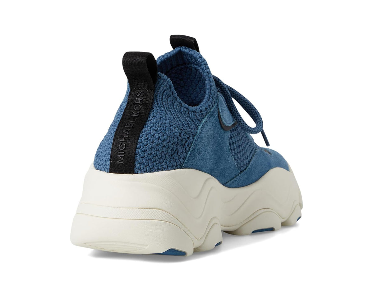 Atlas knit trainer sneaker heel view with dark chambray knit and black pull tab