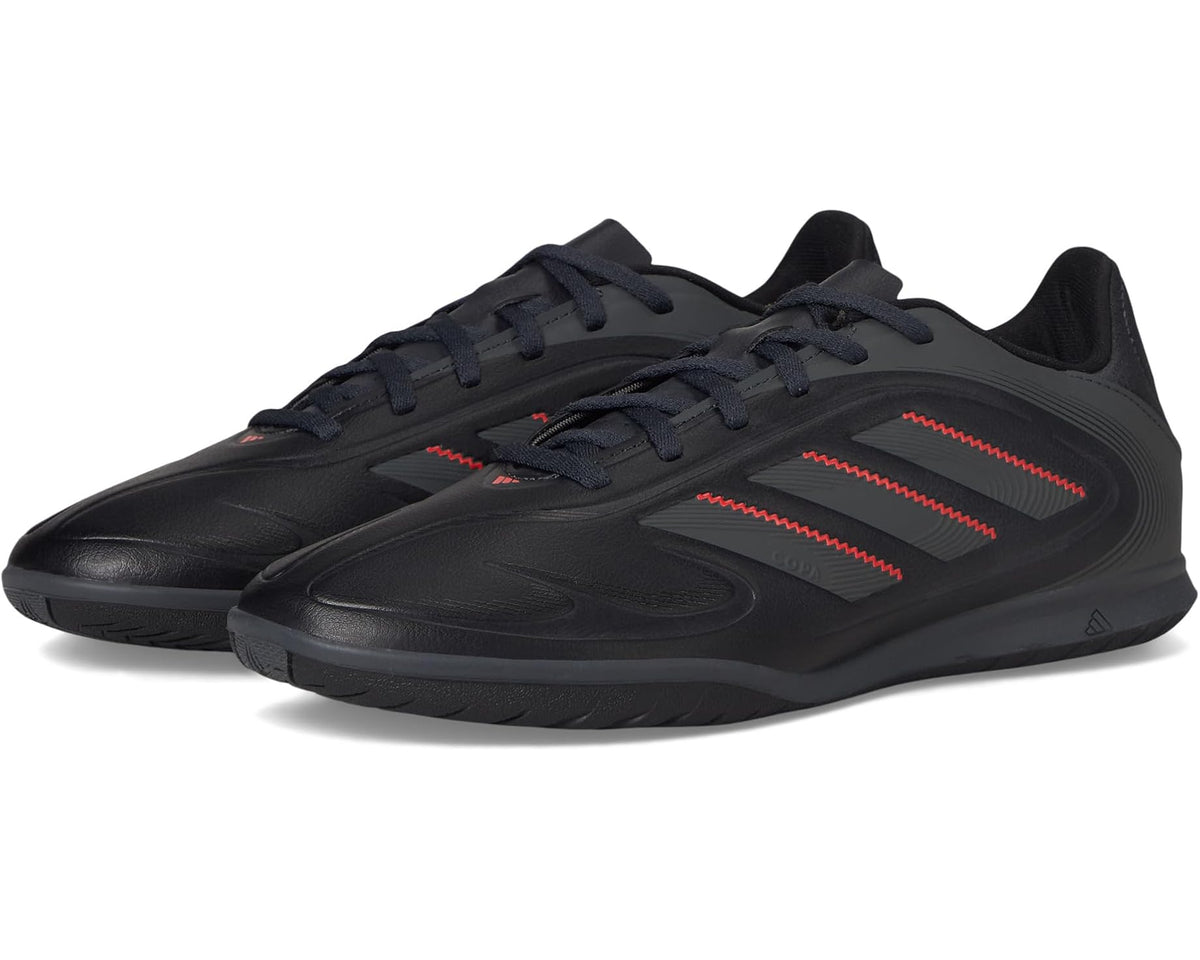 adidas unisex indoor soccer shoes, black with red accents and textured pattern