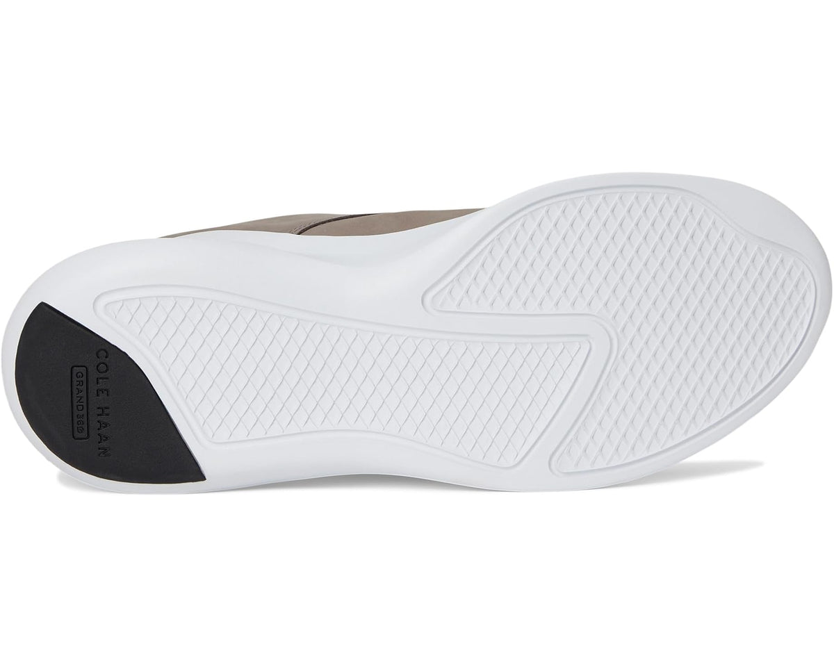 Grey nubuck sneakers outsole view with textured white rubber tread