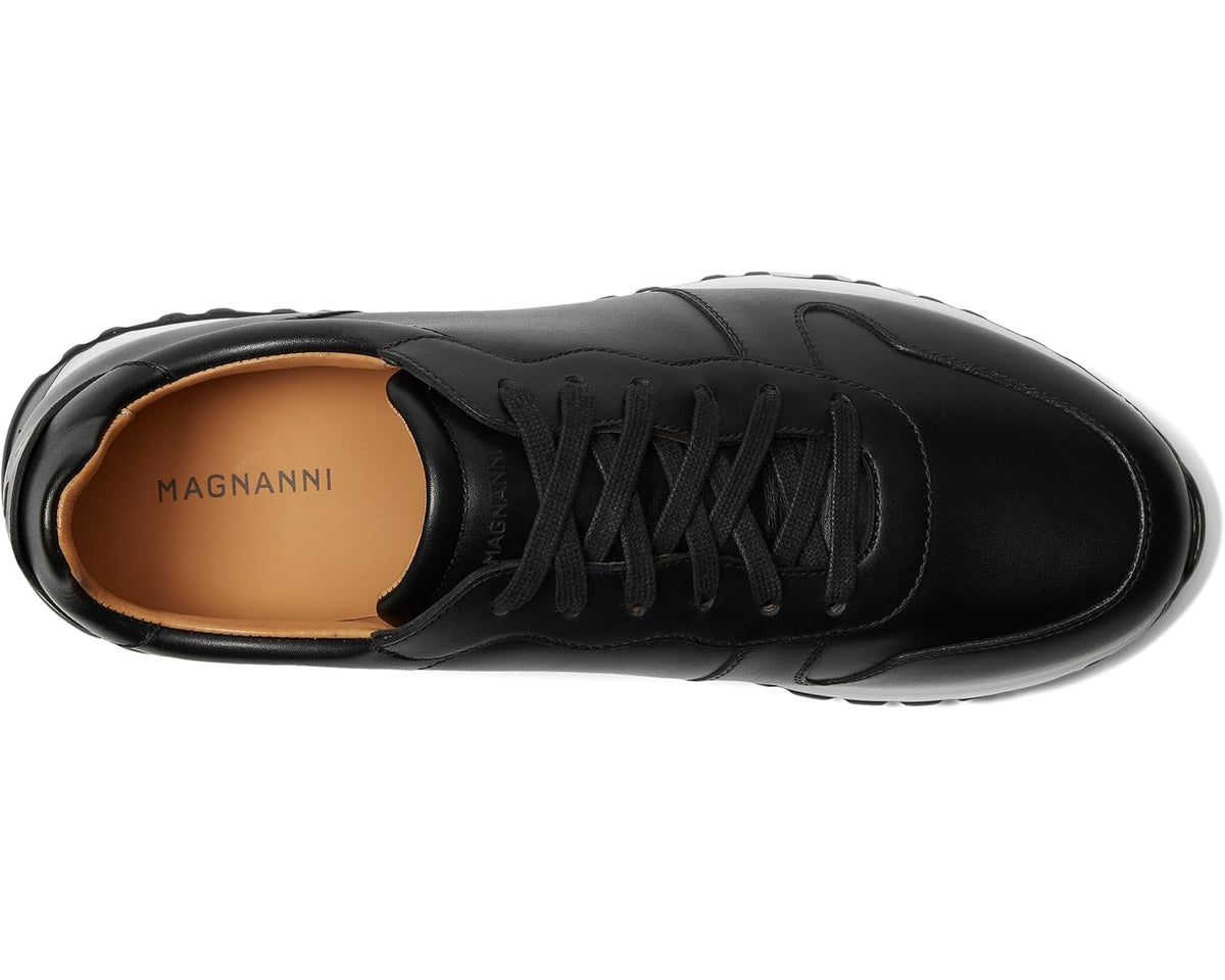 Black lace-up sneaker showing tan interior and MAGNANNI heel logo