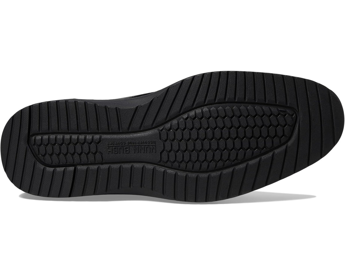 Black oxford shoe outsole with textured tread and rubber grip pattern