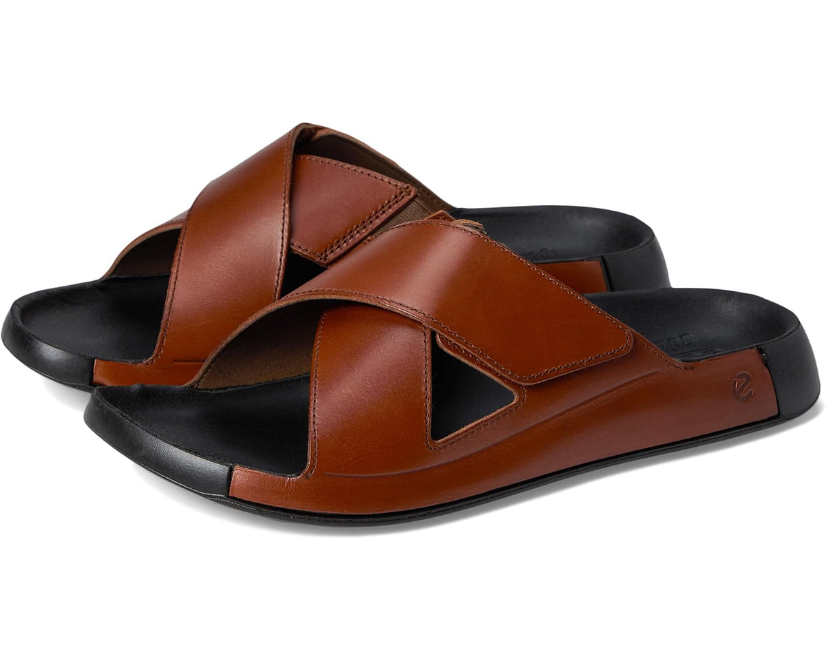 Cognac leather two-strap cross-slide sandal with black rubber sole