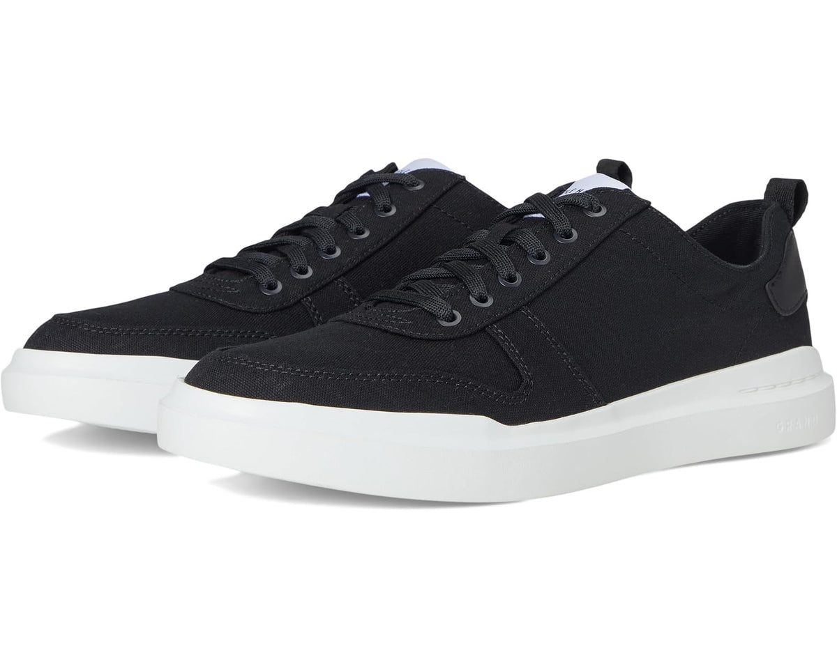 Black canvas court sneaker with lace-up front and white rubber sole