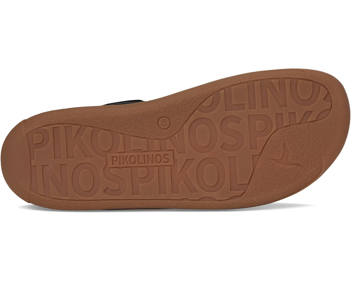 Black sneaker outsole with molded PIKOLINOS tread and tan rubber base