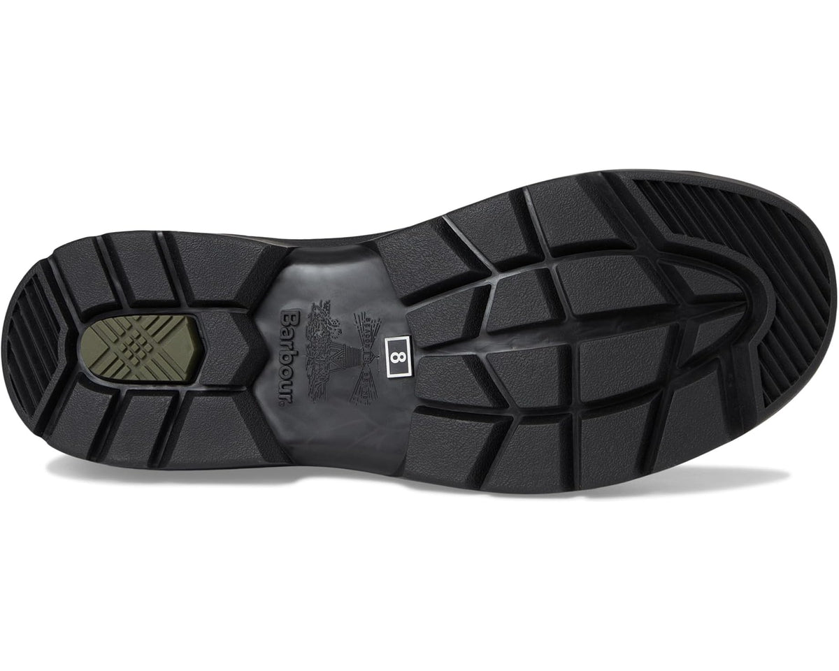 Navy rubber sole of chelsea rain boot with deep tread and traction grooves