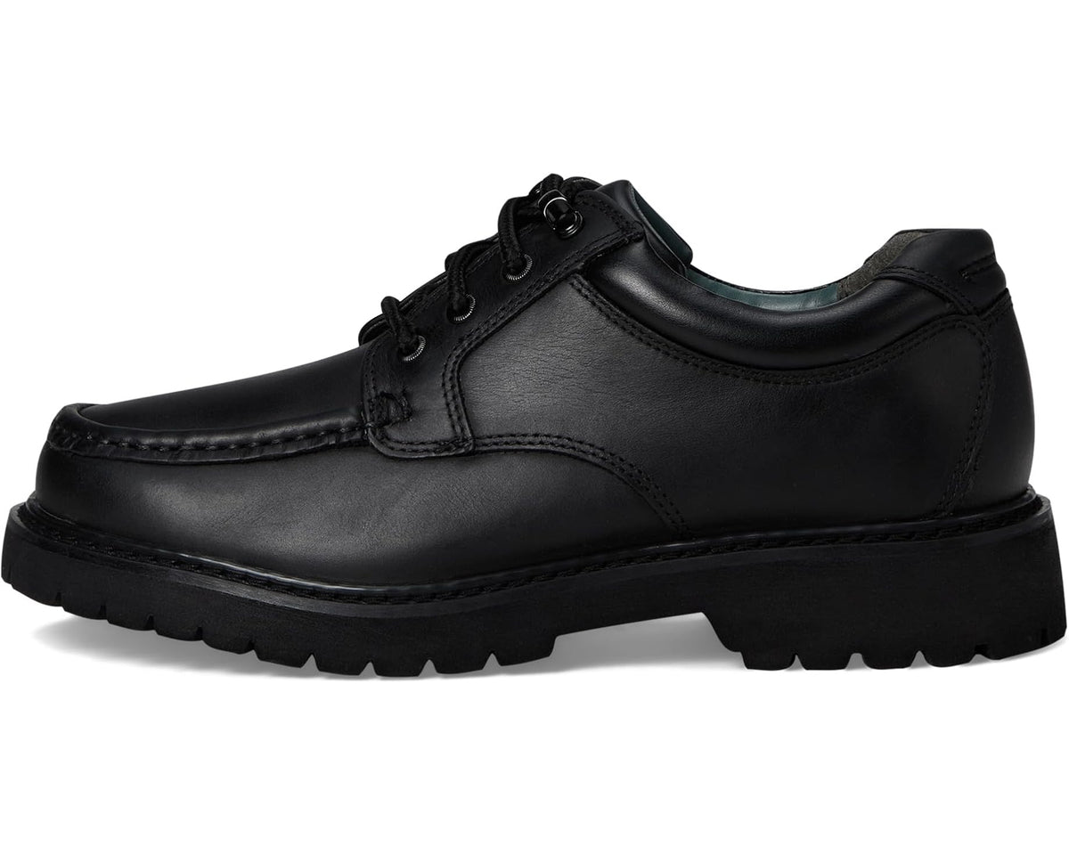 Black lace-up leather shoe with side stitching and chunky platform tread sole.