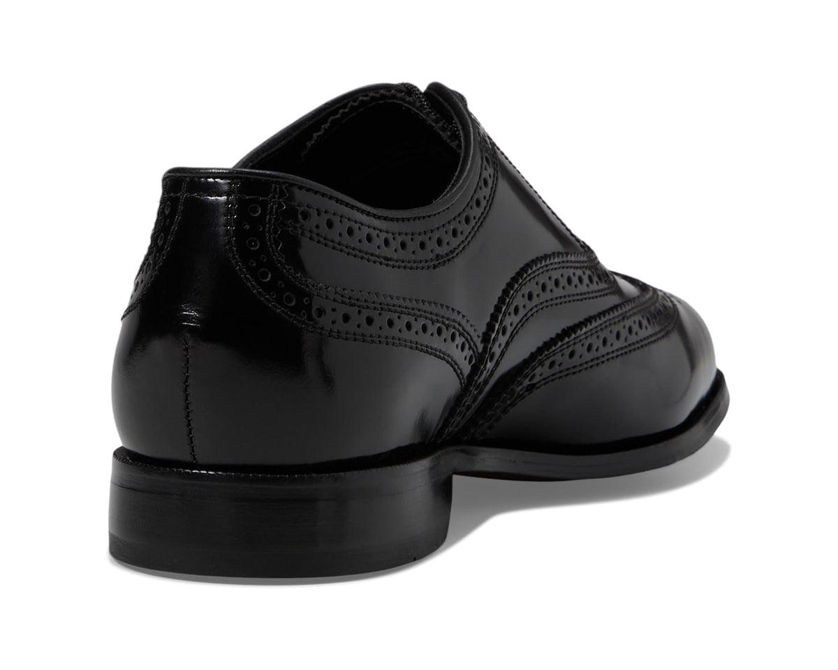 Men's black leather oxford shoes with wingtip brogue and padded heel