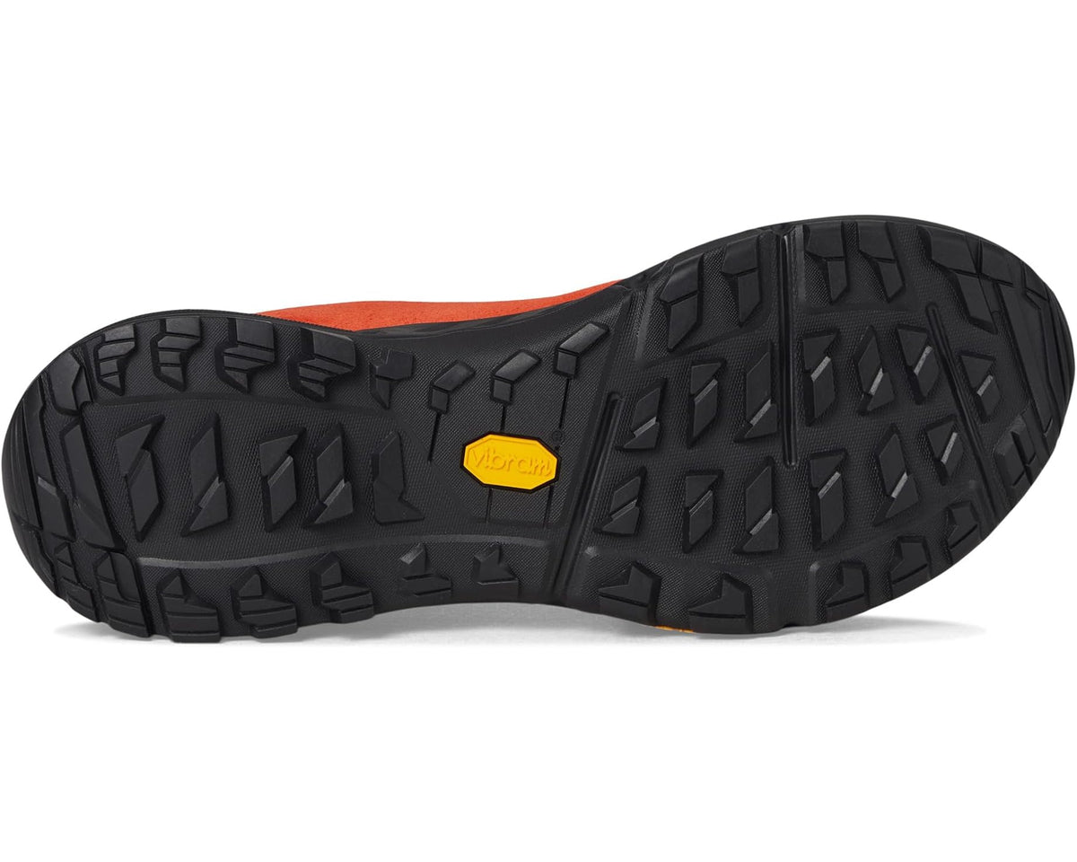 Orange suede outsole view with black rugged tread and Vibram logo on heel