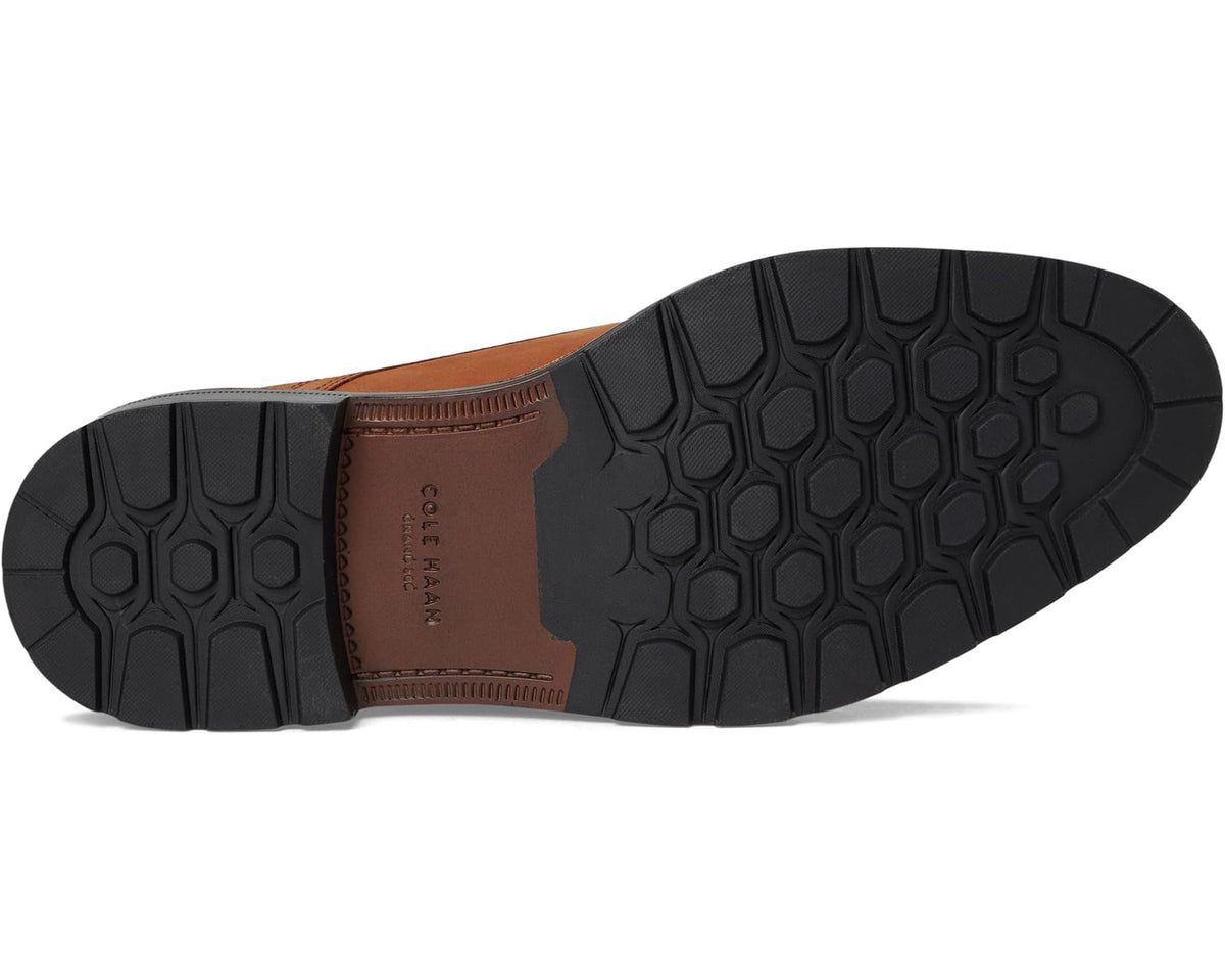 Men's tan oxford outsole with textured tread and stitched welt