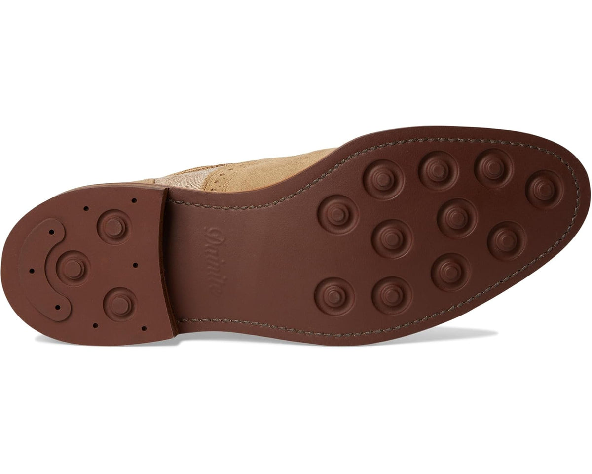 Men's suede oxford shoe outsole with round grip studs and stitched edge trim