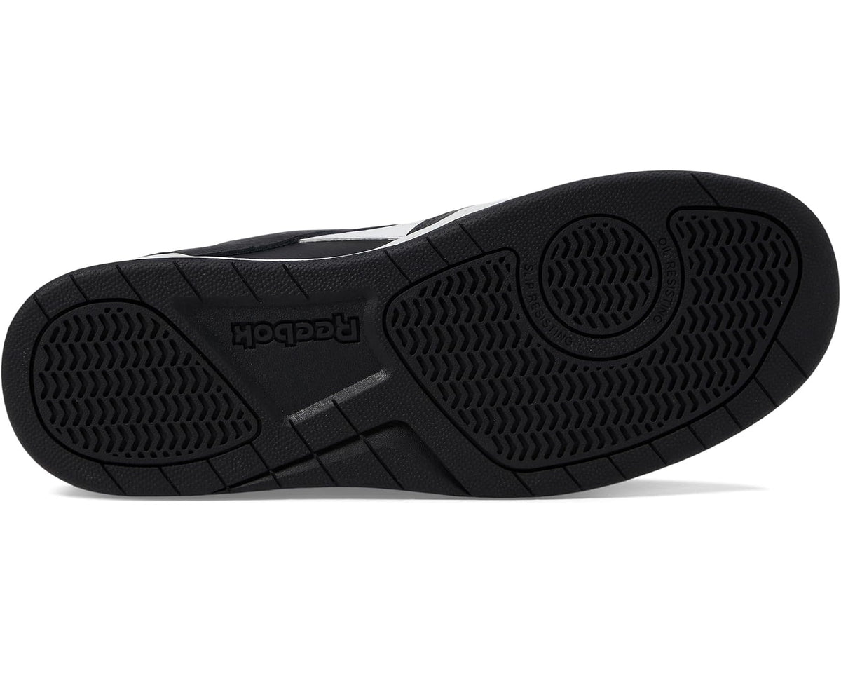 Black rubber outsole tread with circular grip patterns under the sneaker