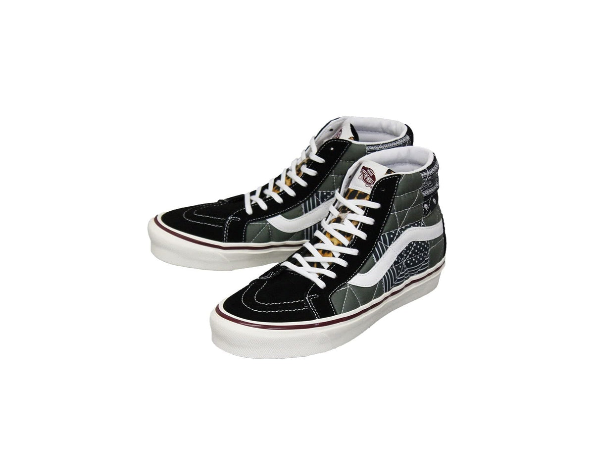 Quilted mix high-top sneakers with black uppers, white laces, and white rubber sole