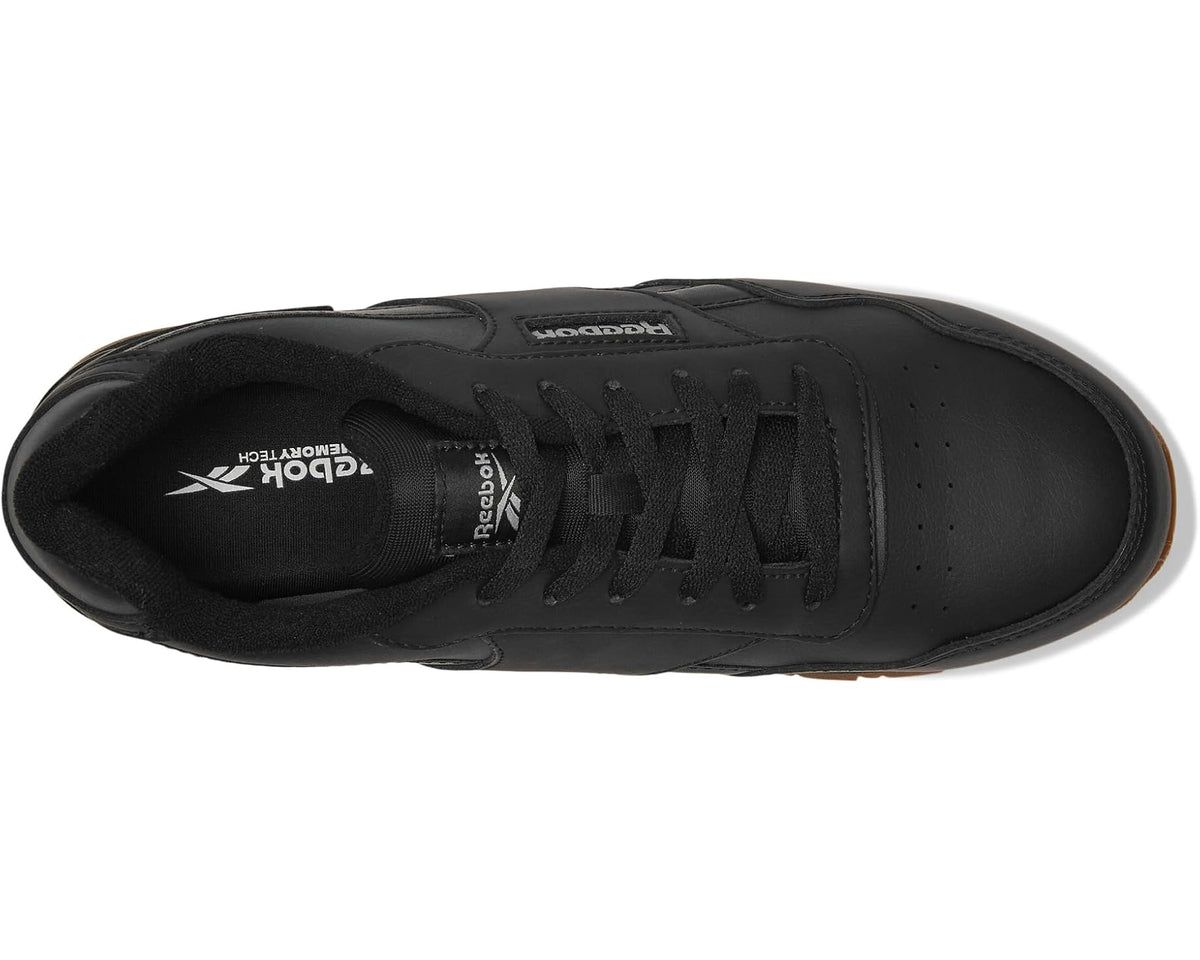 Black lace-up work shoe interior view with Reebok logo on the tongue
