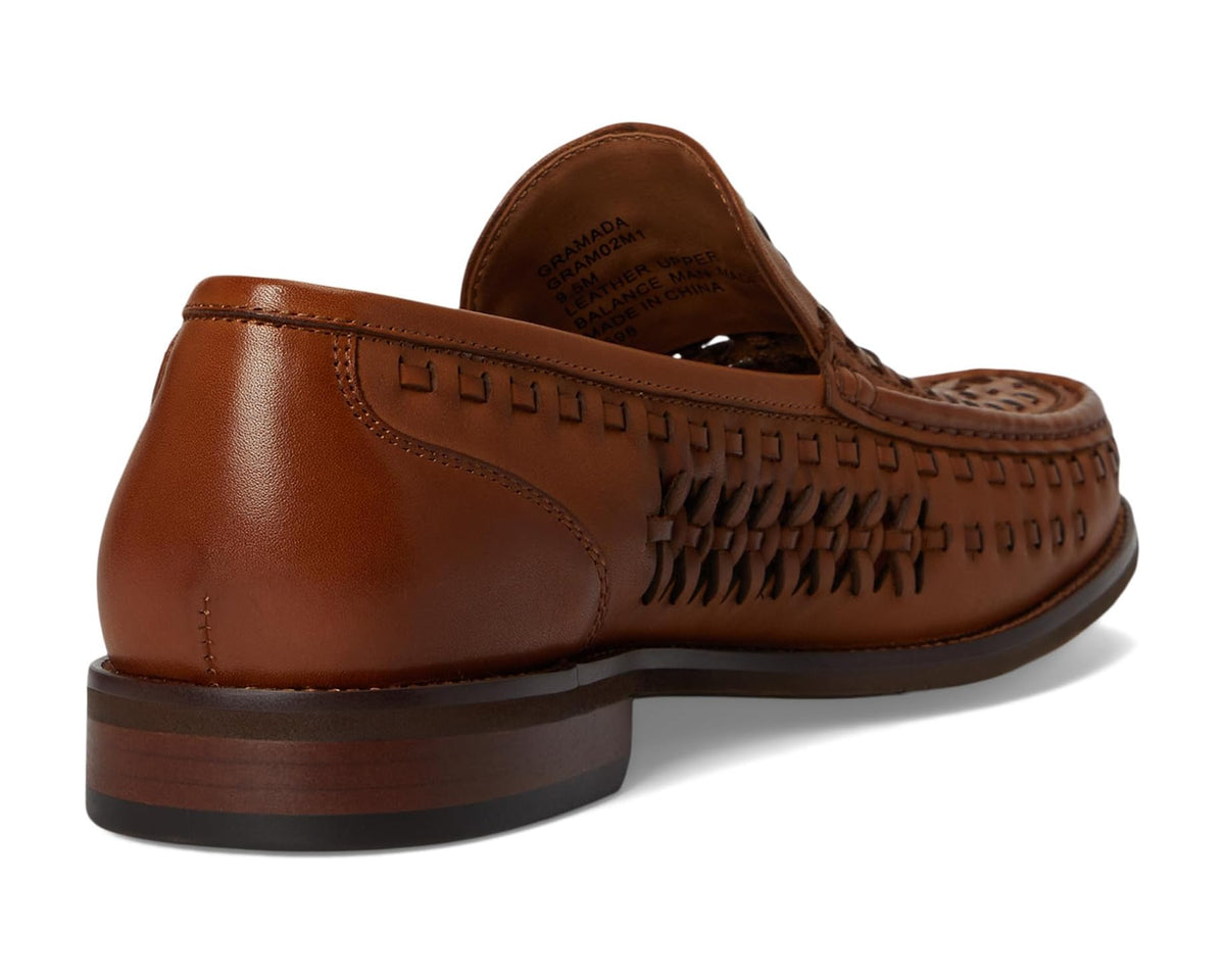 Back view of cognac brown leather loafer with slip-on heel and stitched trim