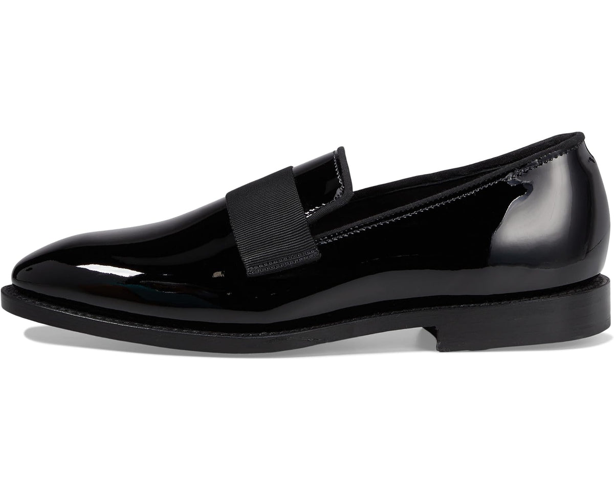 Black patent leather loafer side view with elastic-look strap