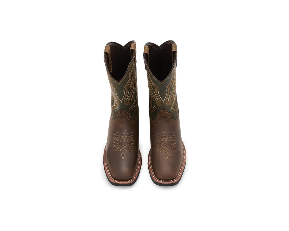 Pair of brown cowboy boots with pointed toe and decorative shaft embroidery