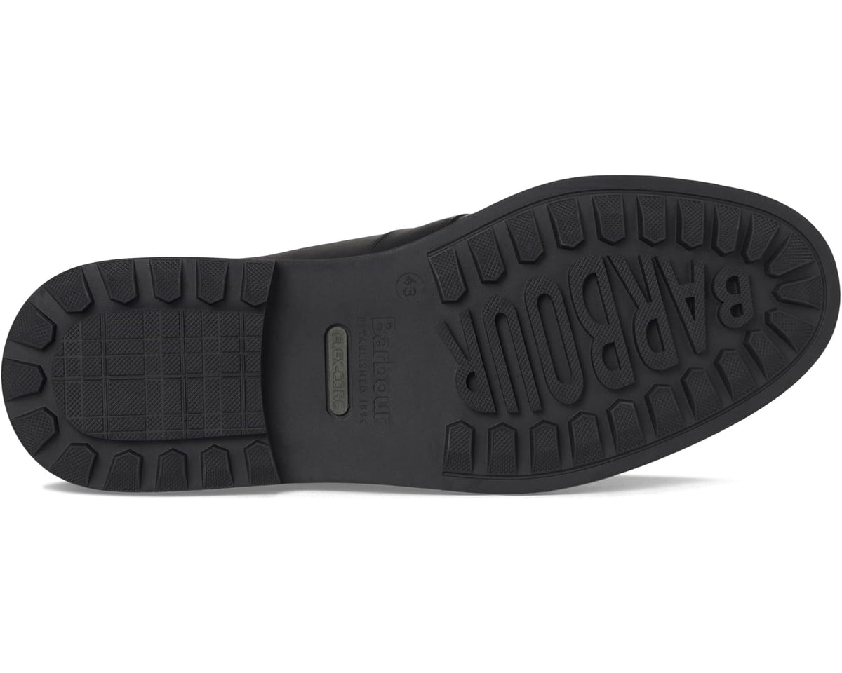 Black chukka boot outsole with rugged tread and BARBOUR text