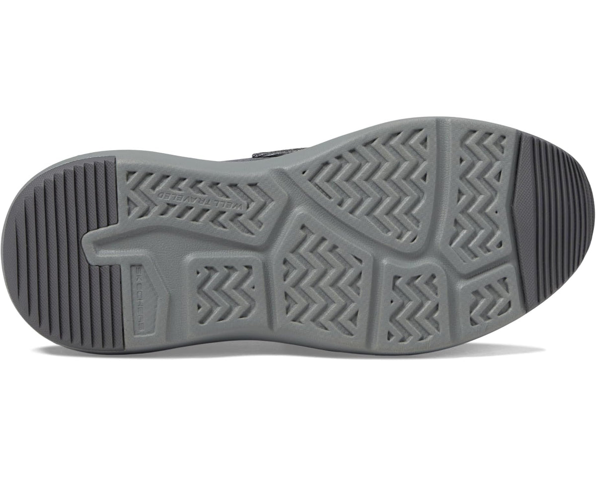 Charcoal slip-on sneaker outsole with patterned tread and sculpted midsole edge