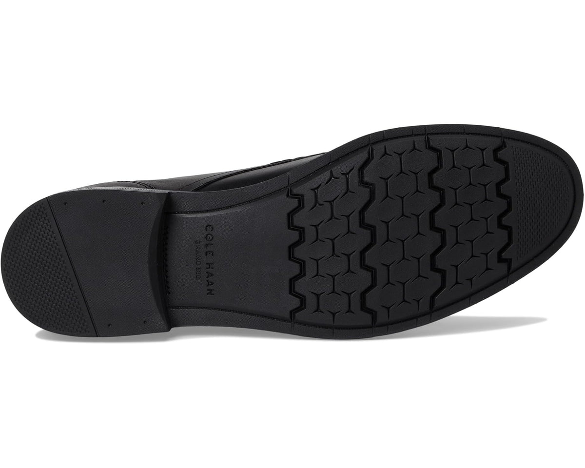 Black oxford shoe outsole with textured tread and sidewall grip pattern