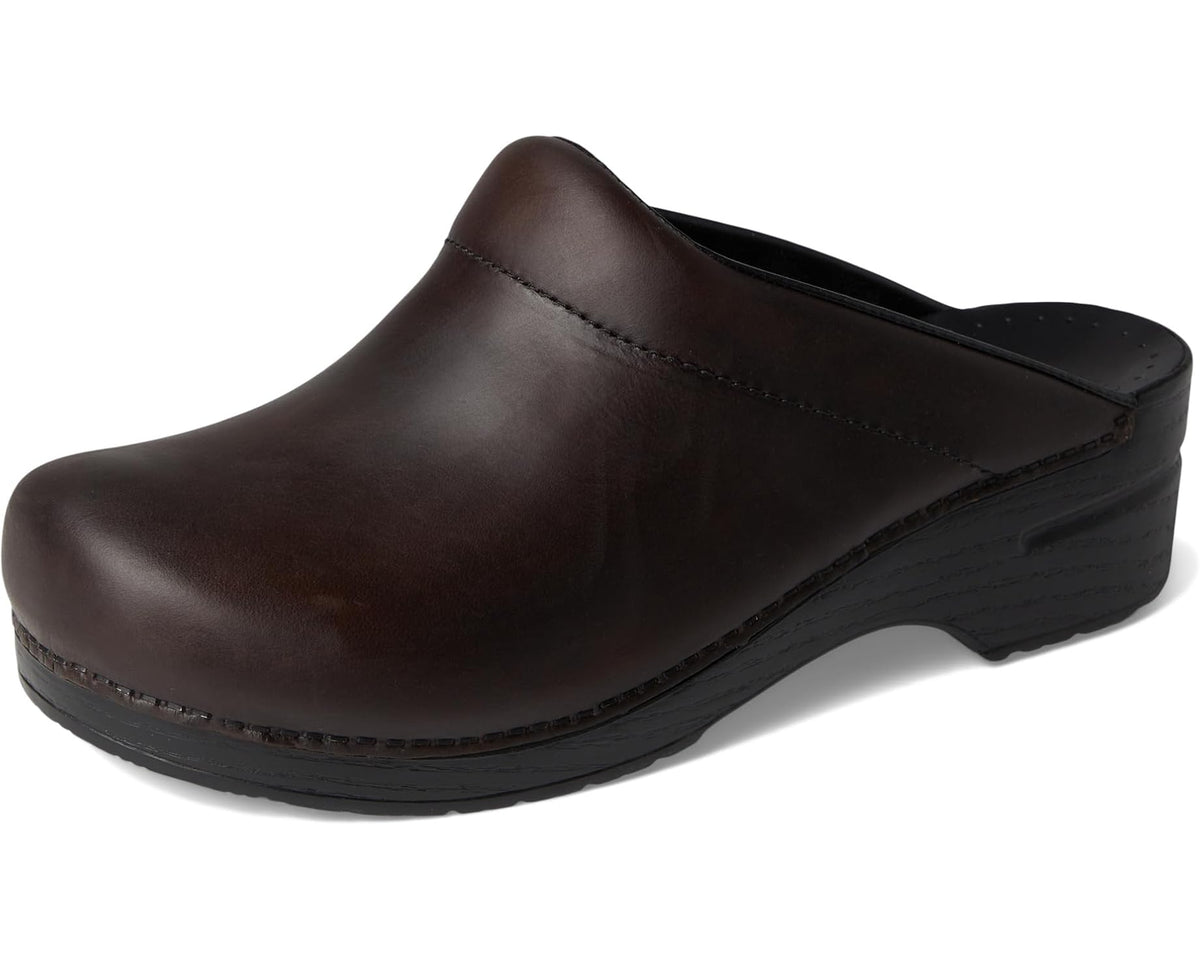 Brown leather slip-on clog with black footbed opening and molded wedge heel
