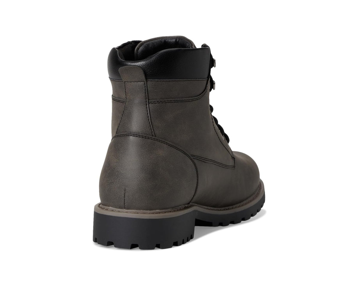 Men's charcoal ankle boot heel with black lining and thick rubber lug sole.