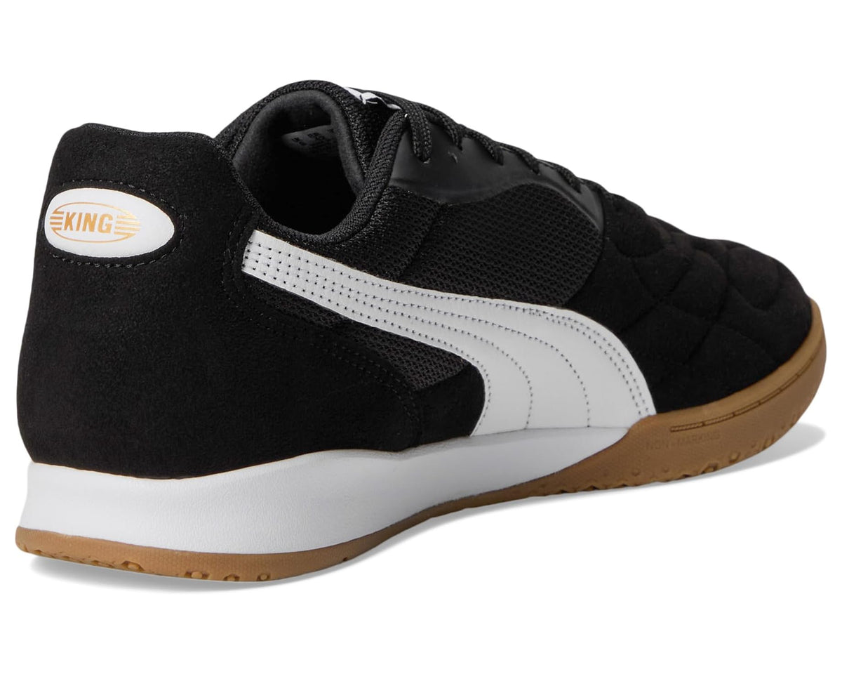 Men's indoor soccer trainer shoes with black heel panel, white stripe, and gum sole