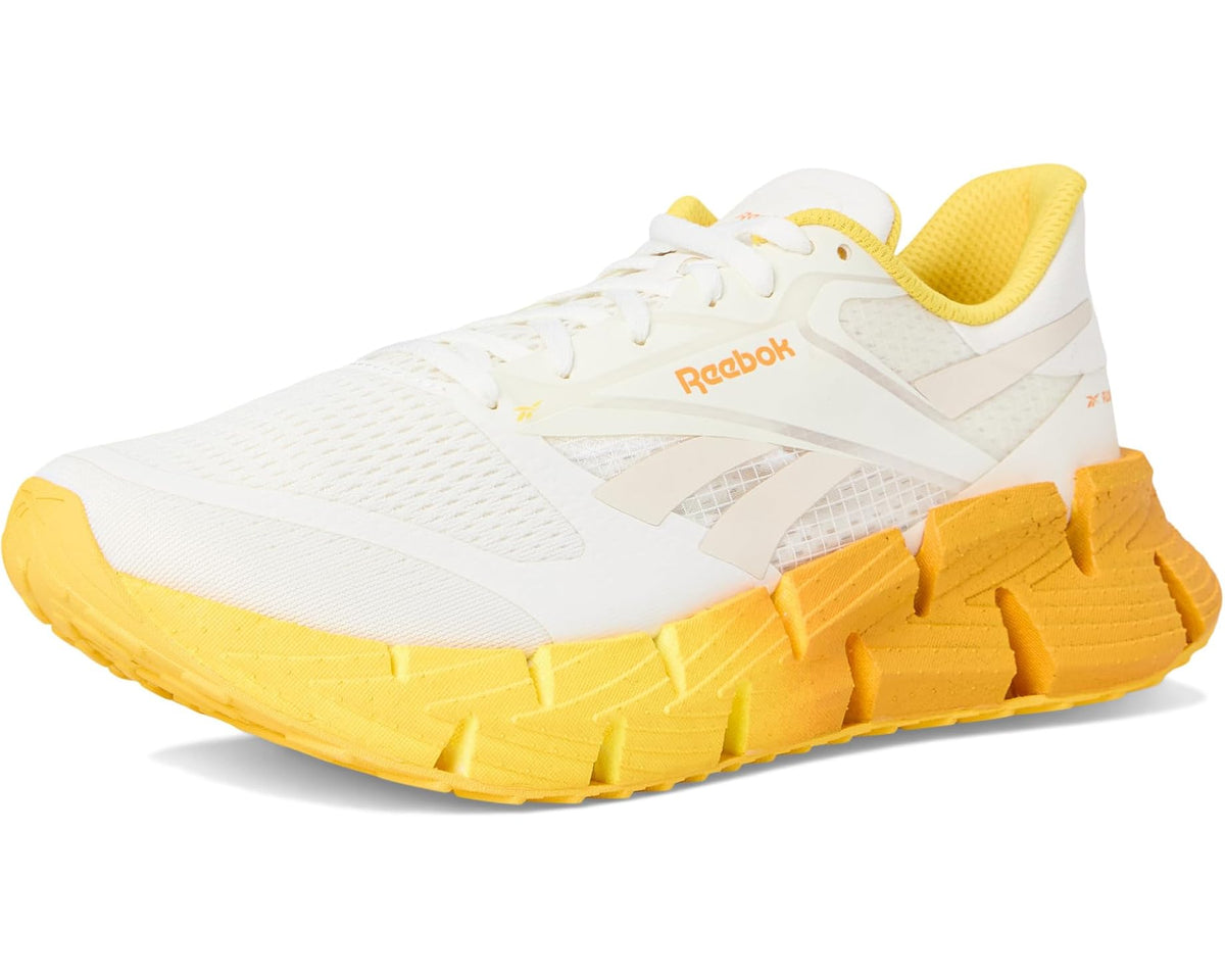 Men's white and yellow lace-up running shoe with Reebok logo and cushioned sole