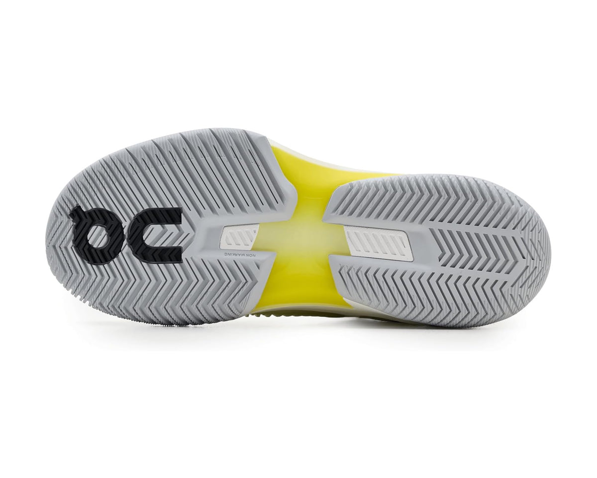 On sneakers outsole with textured tread and lime midsole accent