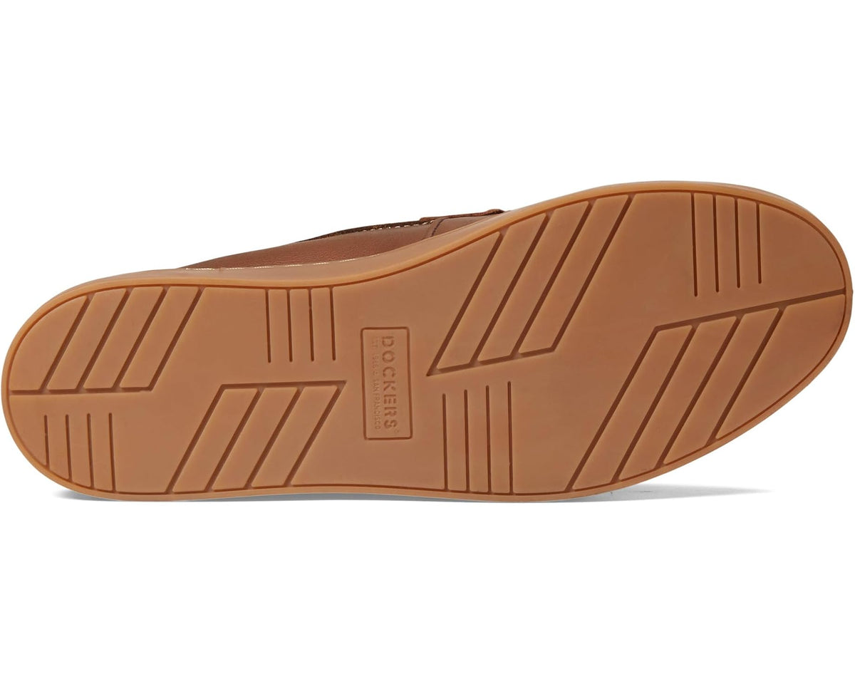Tan leather-look loafer outsole with rubber tread and geometric grooves