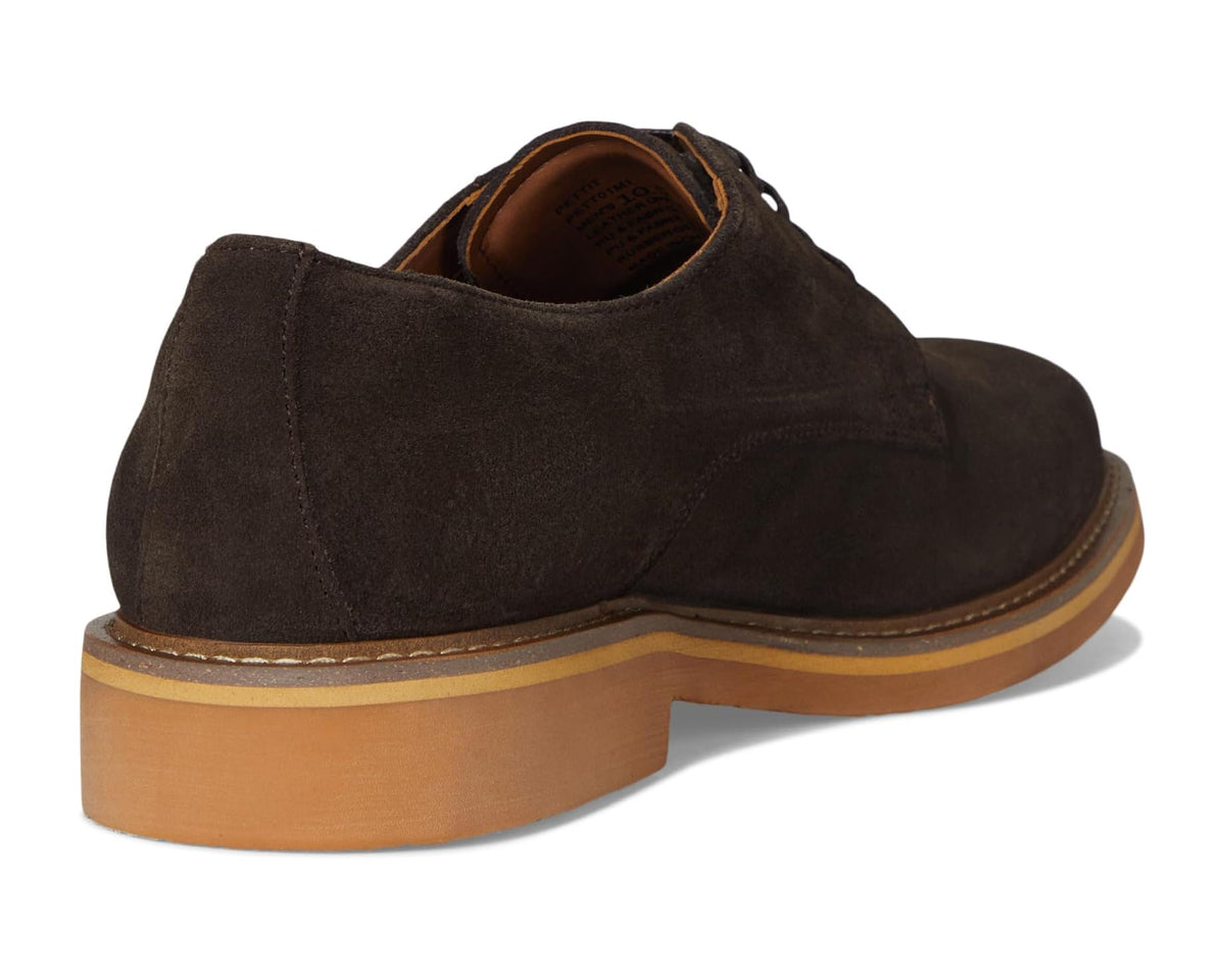 Brown suede oxford with stitched sole edge, lace-up vamp, and low stacked heel.