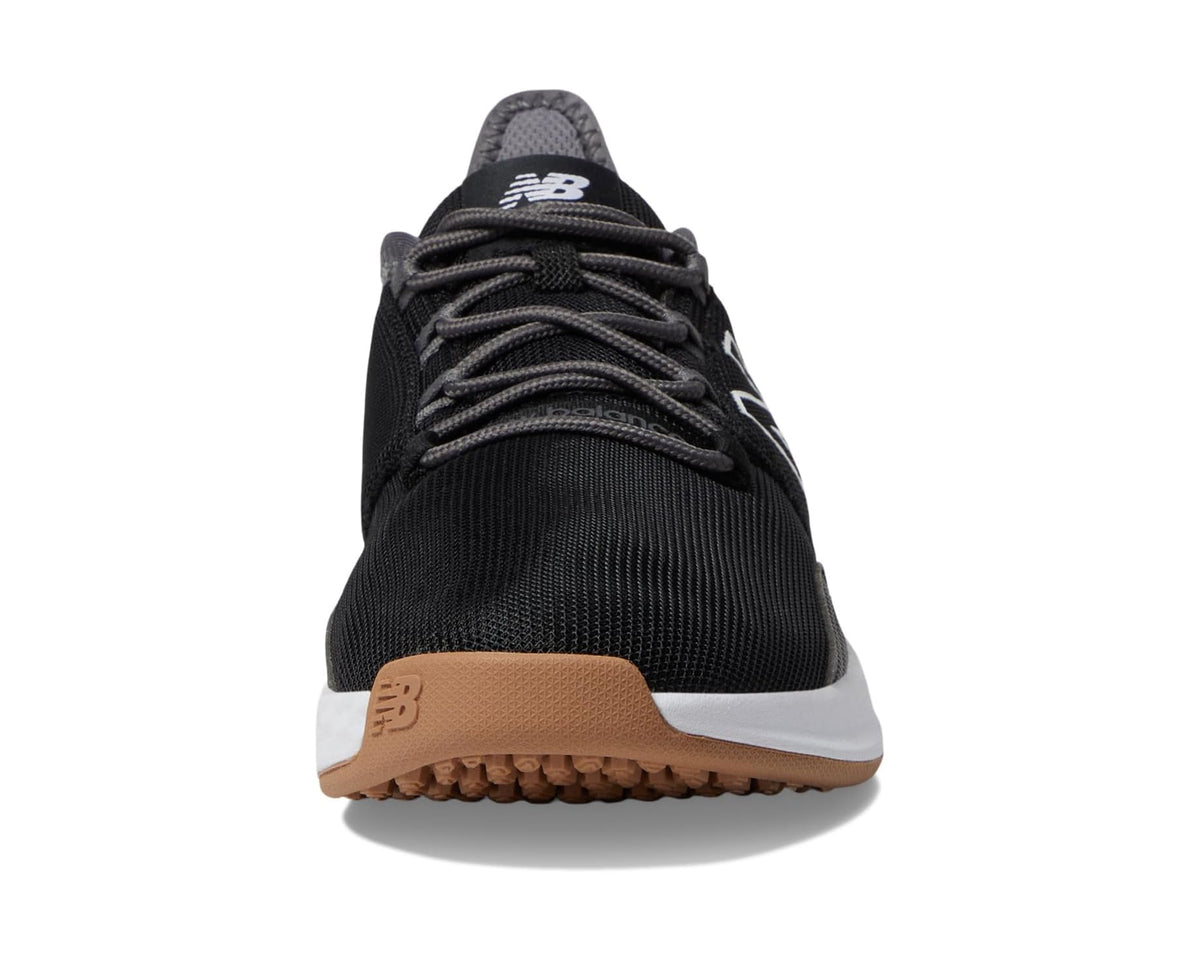 Black New Balance golf sneaker front view with tan heel panel and white midsole