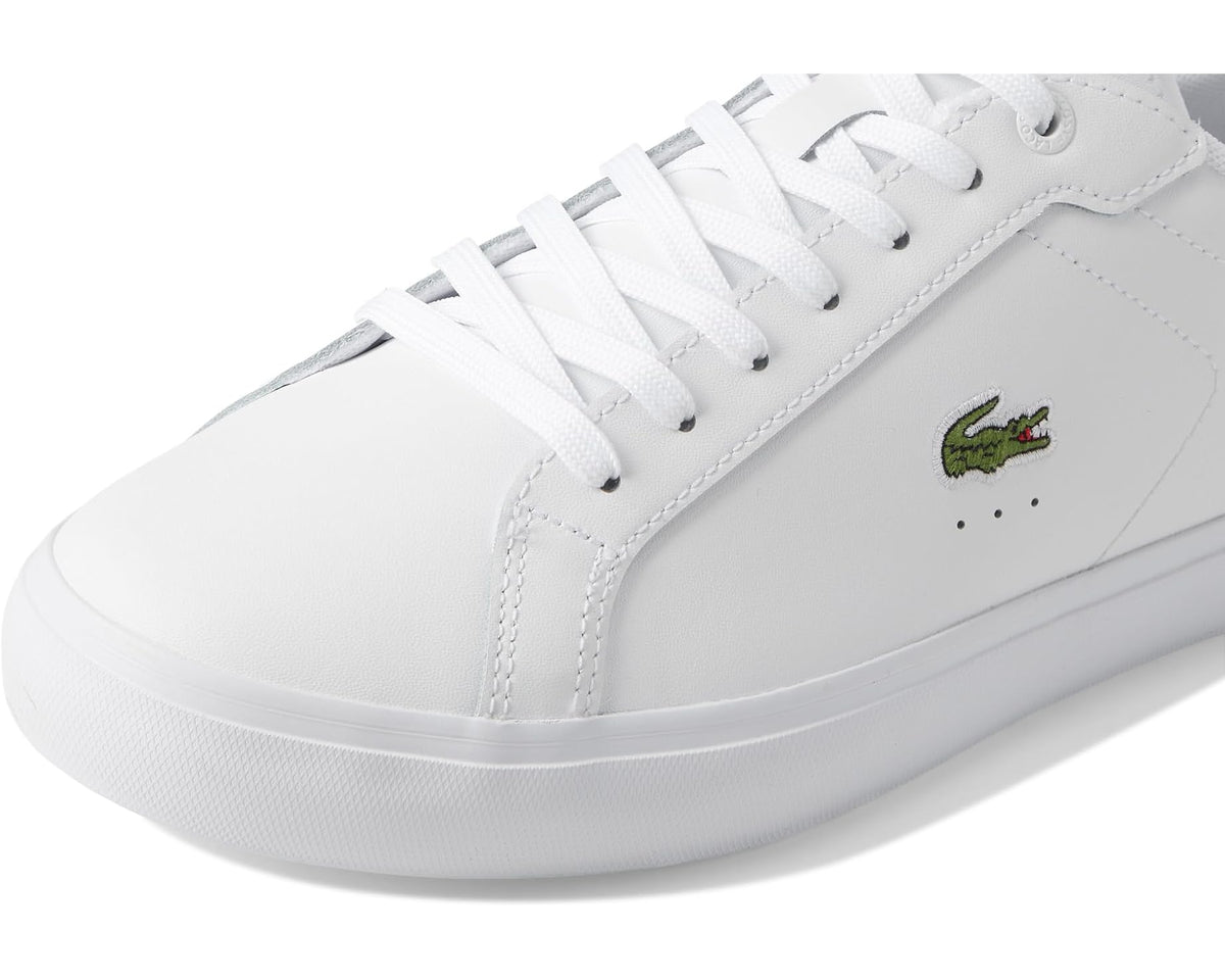 White Lacoste lace-up sneakers with perforated panels and green crocodile logo