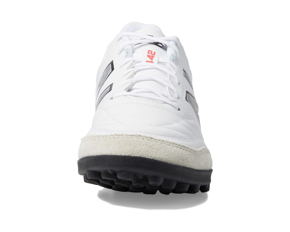 Men's white soccer cleat with black side logo and textured turf sole
