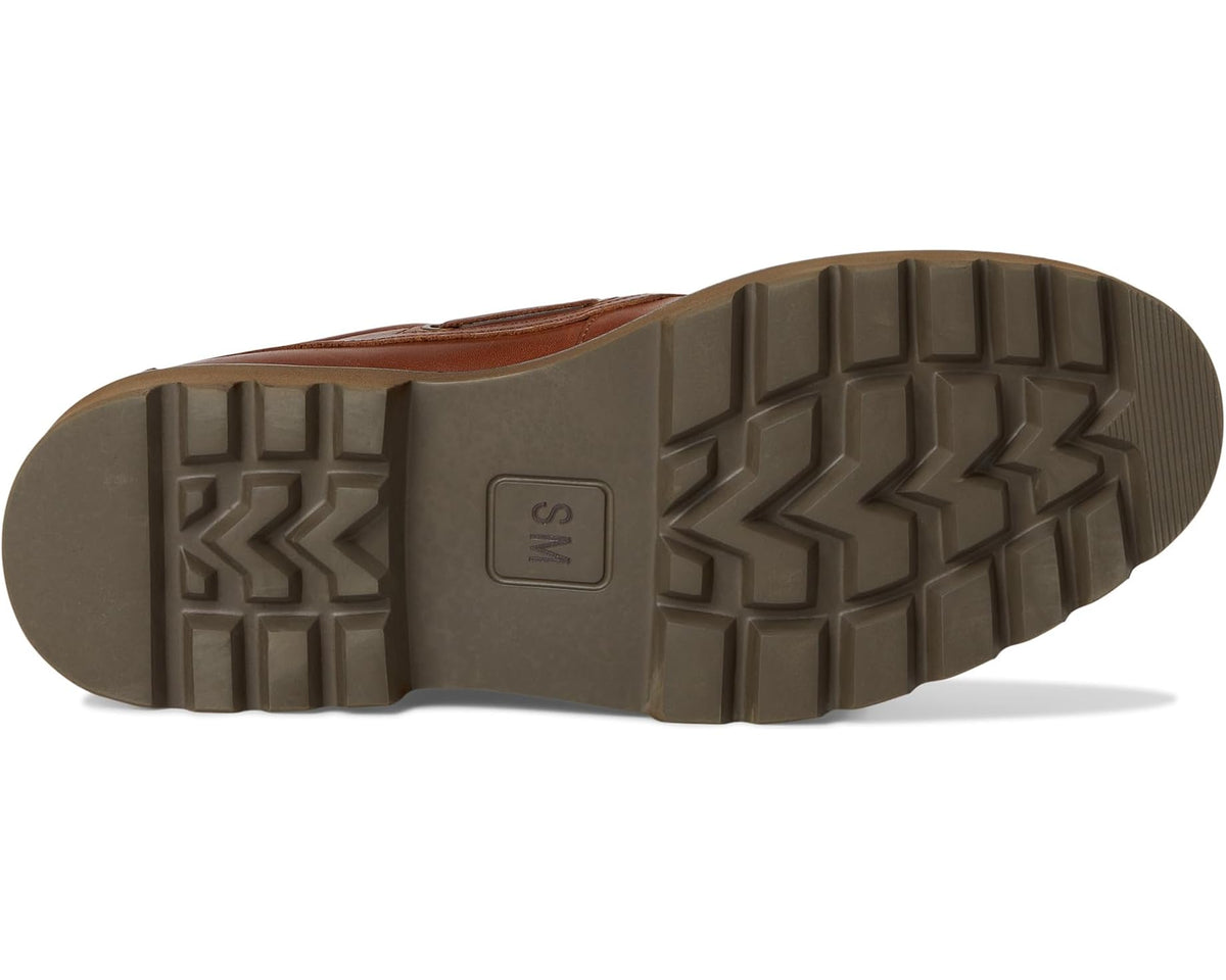 Men's tan leather boat shoe outsole view with deep tread on platform sole
