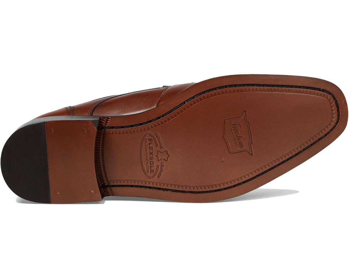 Cap-toe oxford shoe outsole view with embossed logo, cognac leather