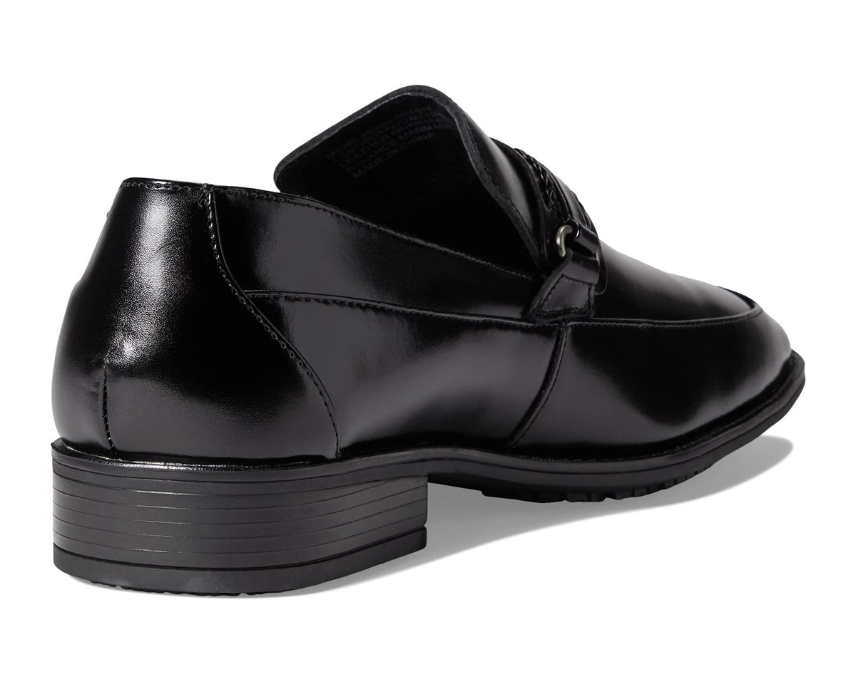 Black slip-on loafer back view with cushioned collar and stacked rubber heel sole.