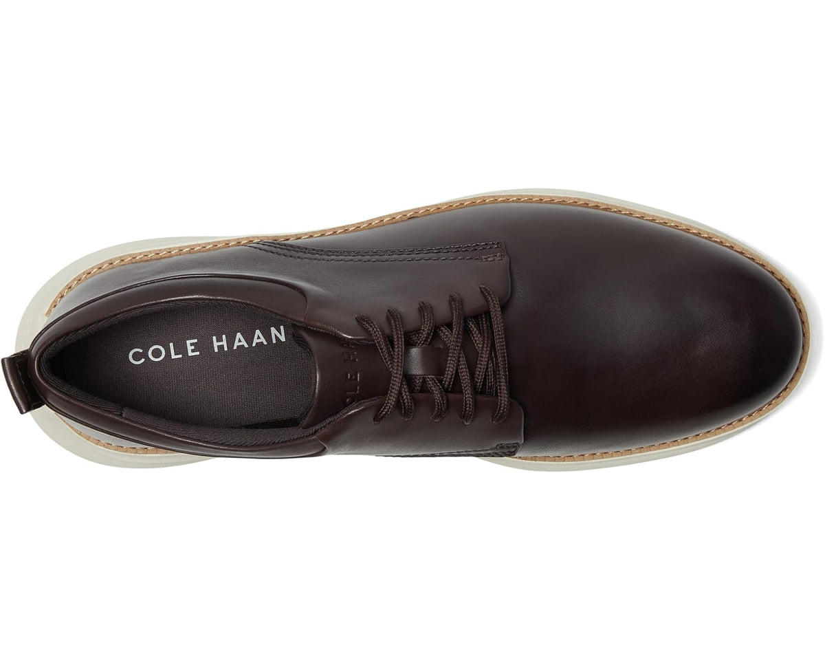 Men's lace-up oxford shoe in dark brown leather with Cole Haan logo on tongue