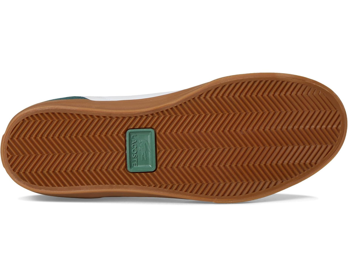 Gum rubber outsole with herringbone tread and Lacoste-branded heel patch