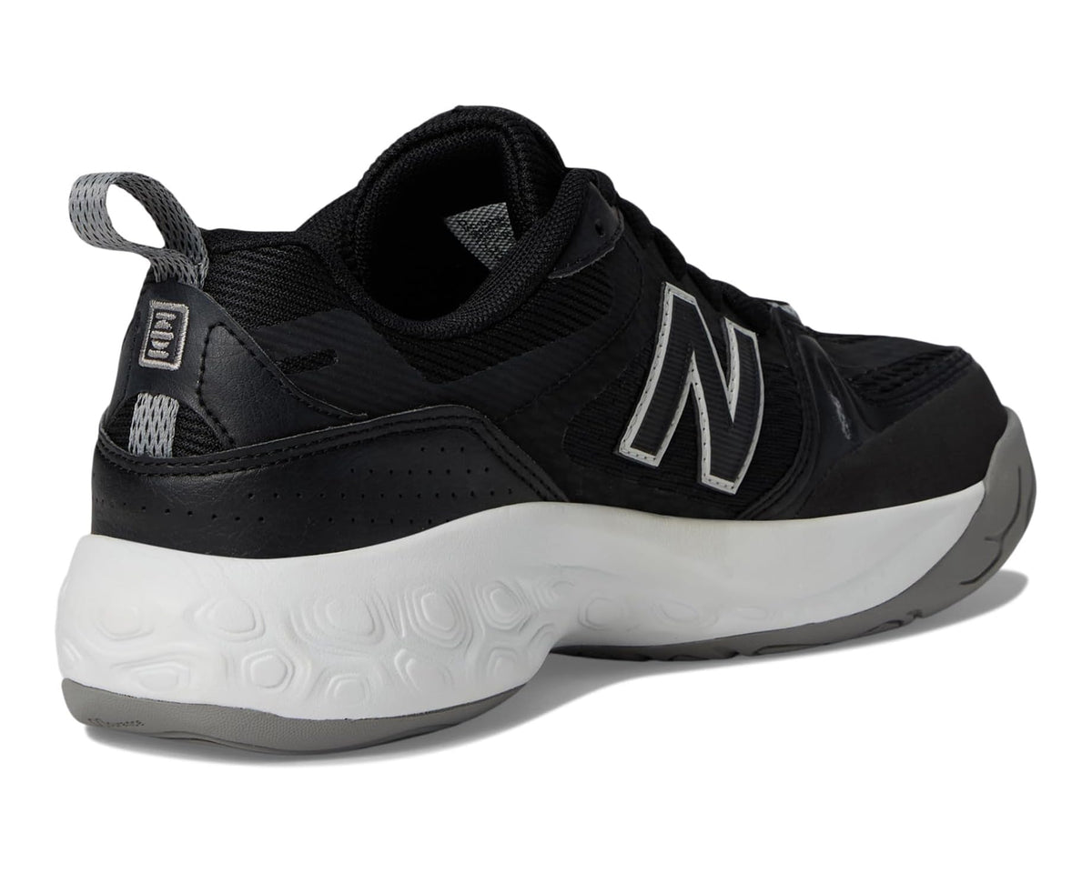 Black New Balance tennis shoe heel and side panel view, white midsole