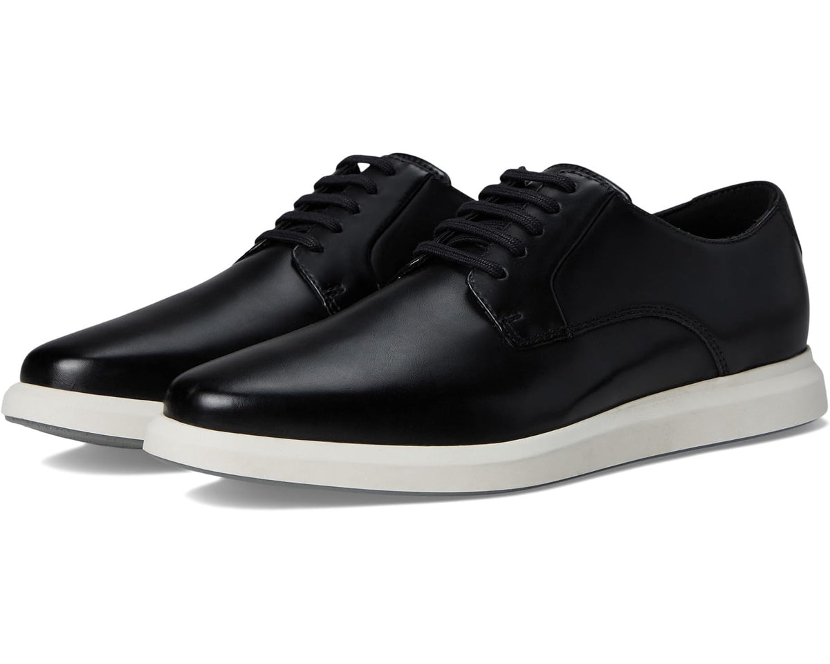 Men's black leather low-top sneakers with lace-up closure and white rubber sole